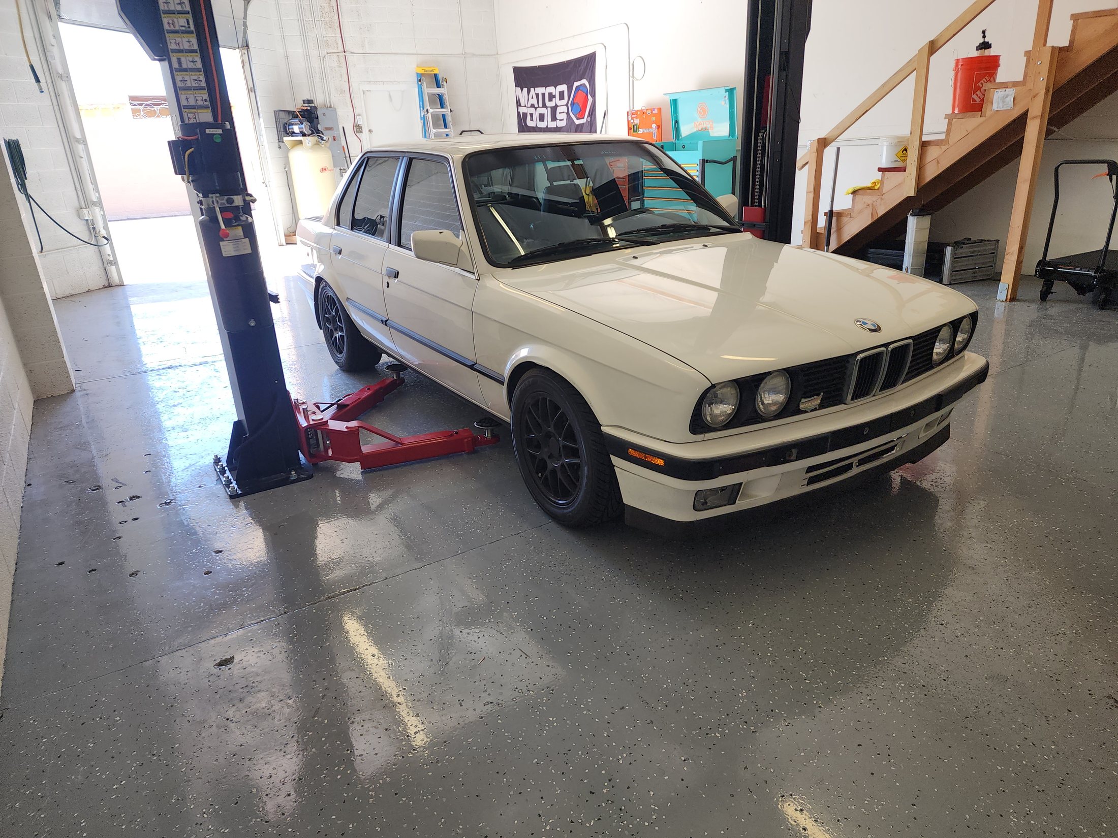 BMW E30 inside the Precision European Auto Repair service bay