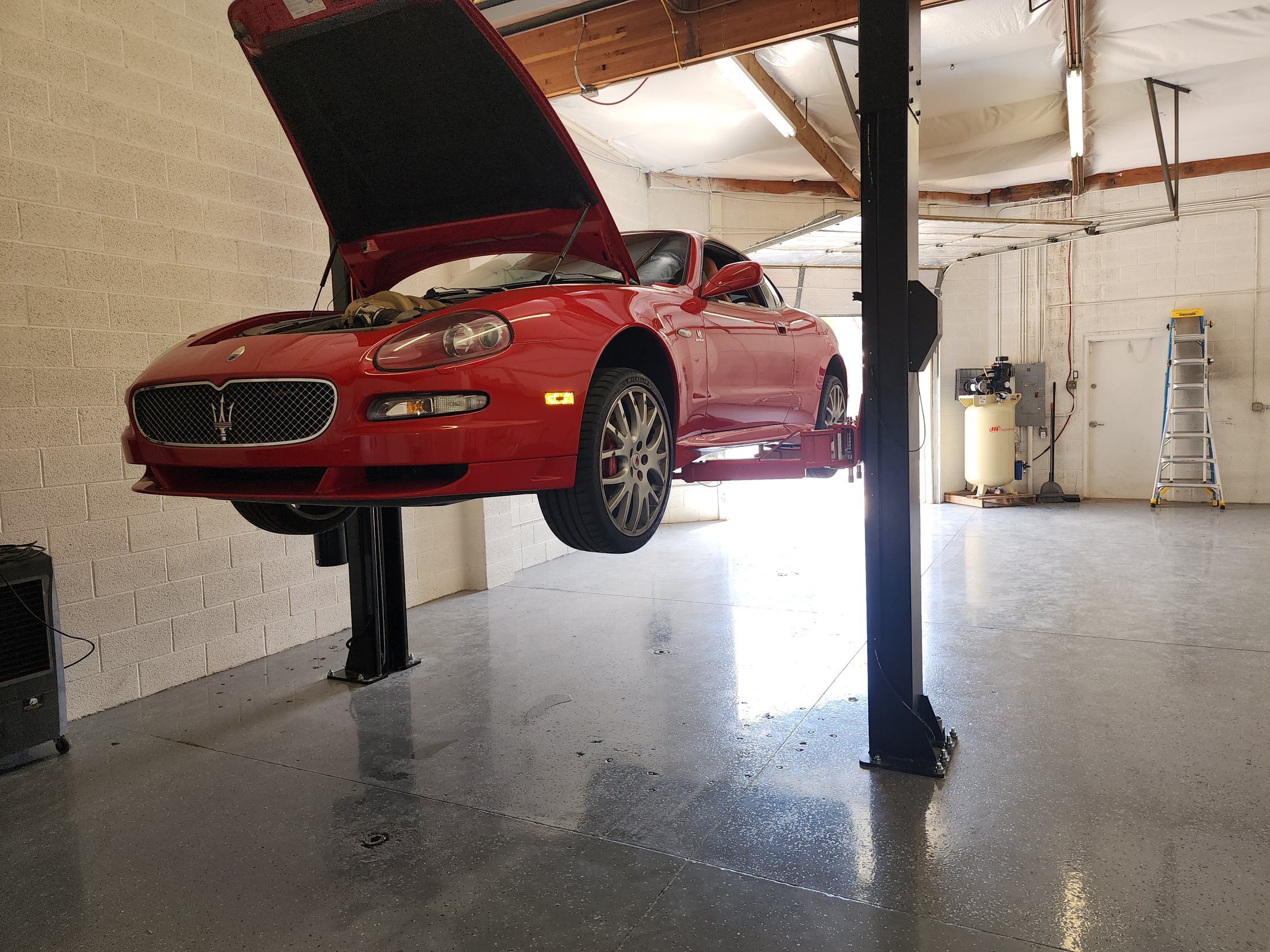 Maserati on a lift inside Precision European Auto Repair